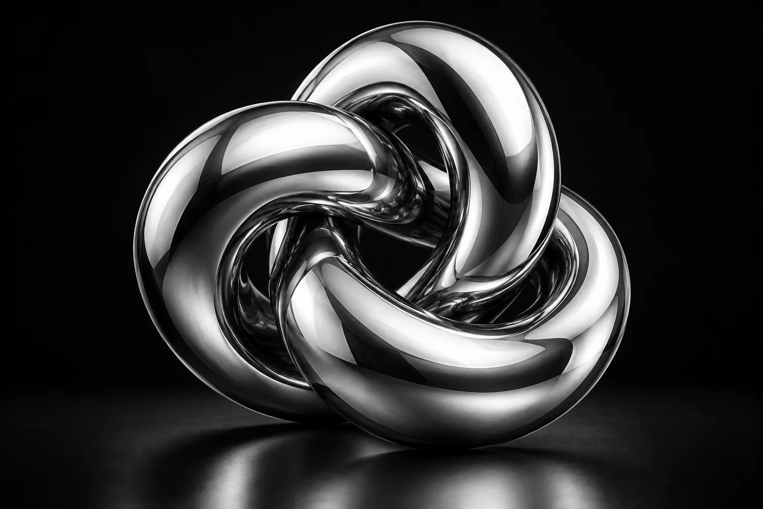 Sculptural chrome knot reflecting studio light against a black background